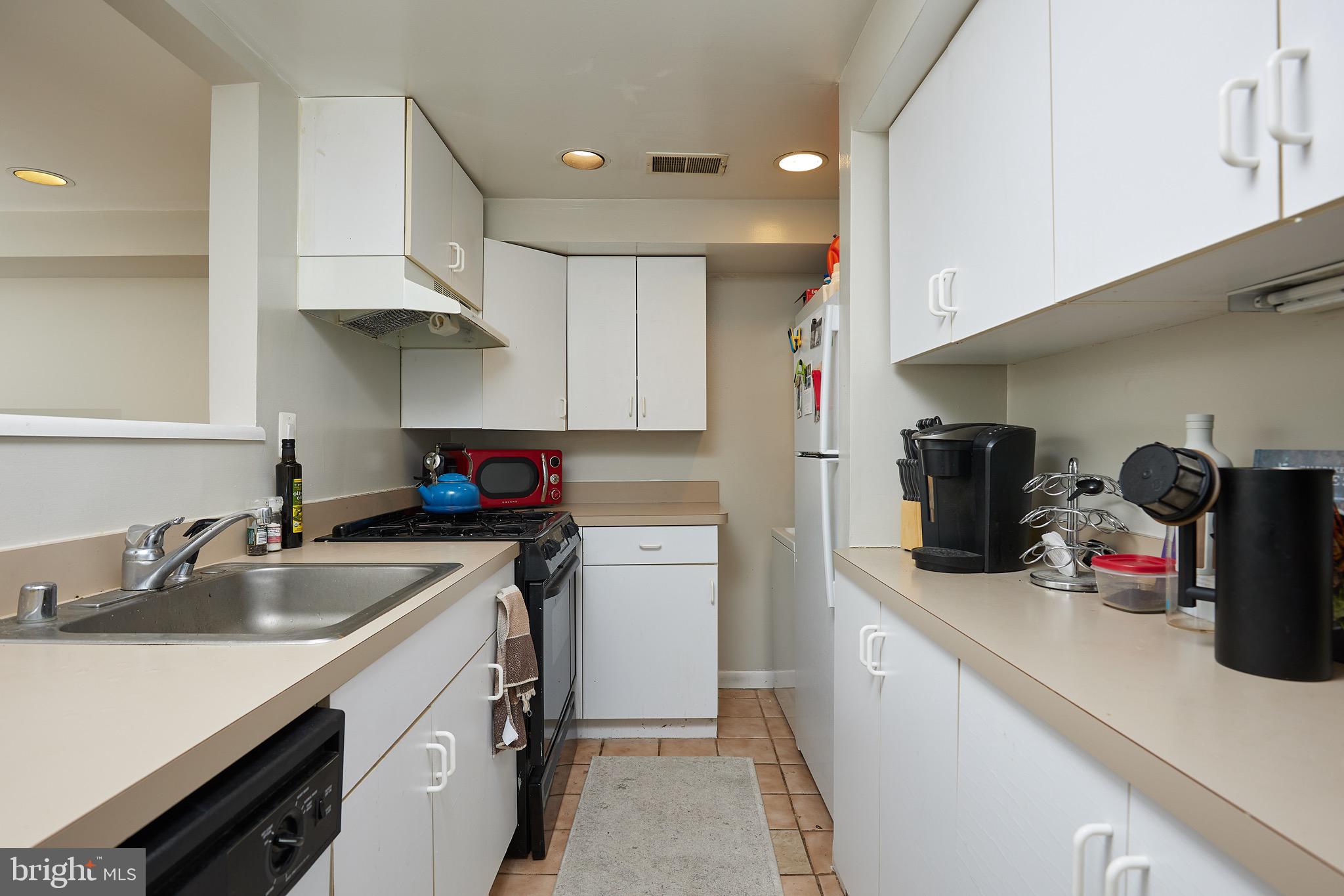 1745 T Street Northwest Washington, DC 20009 - Photo 31 of 35 a kitchen with refrigerator and cabinets
