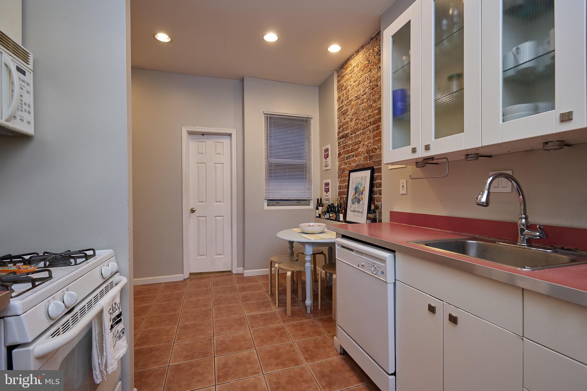 1745 T Street Northwest Washington, DC 20009 - Photo 8 of 35 a kitchen with a sink and cabinets