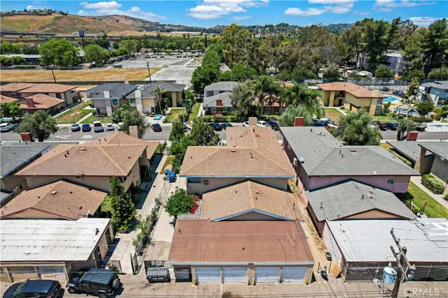 an aerial view of residential houses with outdoor space