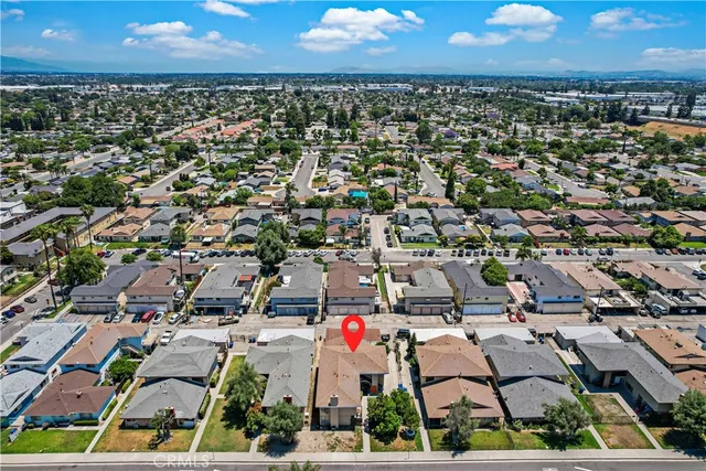 an aerial view of residential houses with outdoor space