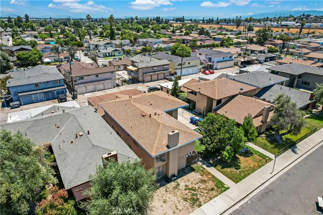 an aerial view of a city with lots of residential buildings