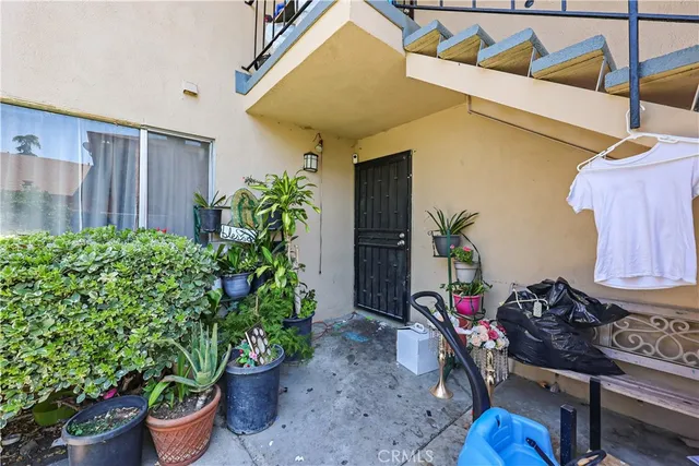 a view of a chairs and table in a patio