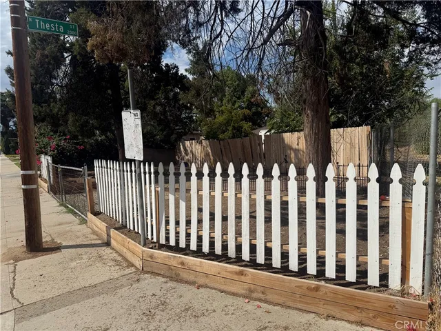 a view of a white fence