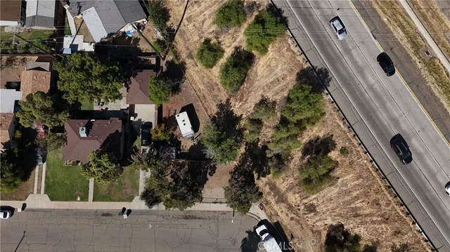 an aerial view of houses with trees