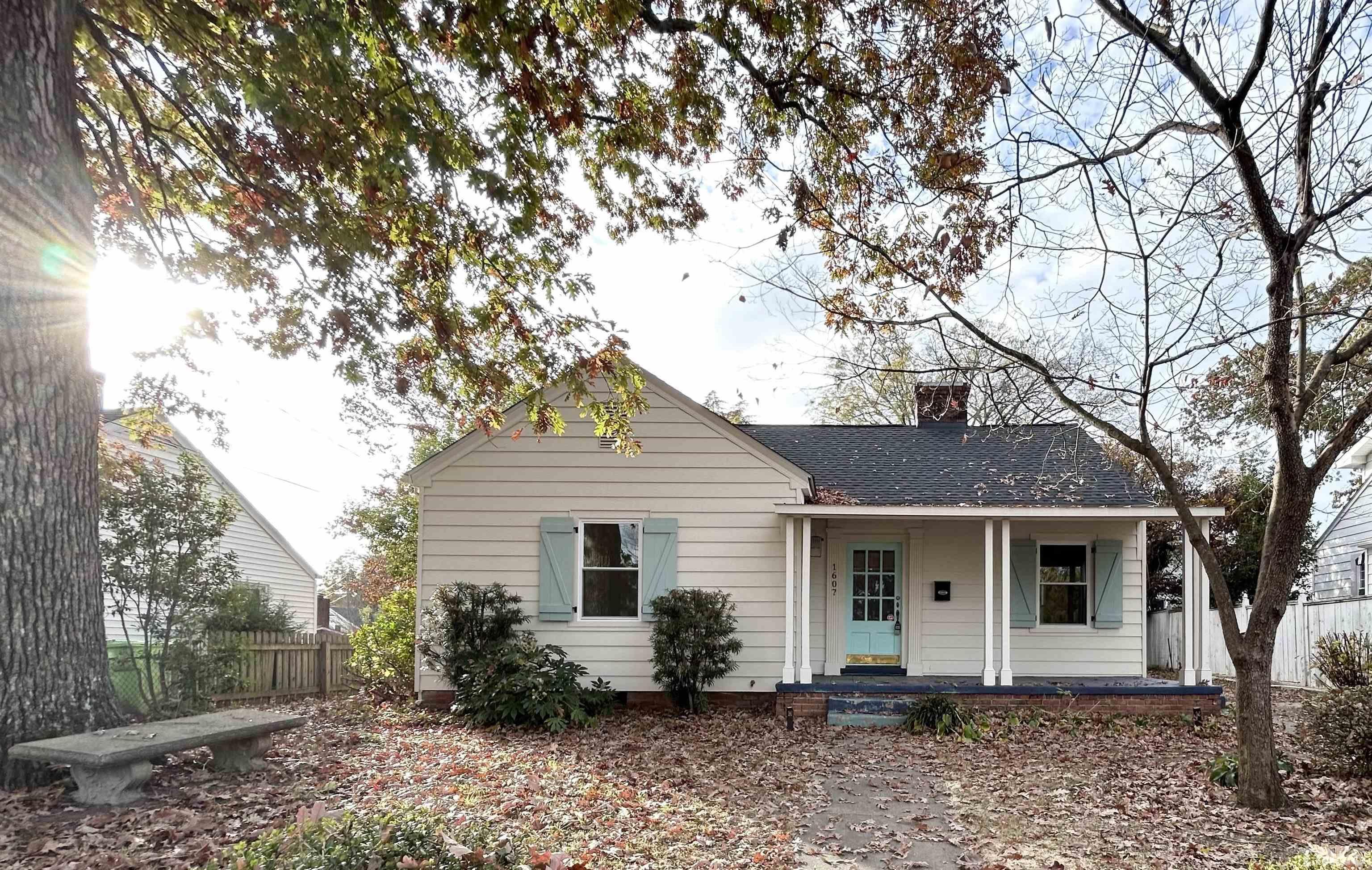 1607 Carson Street Raleigh, NC 27608 - Photo 1 of 17 a front view of house with yard and trees around