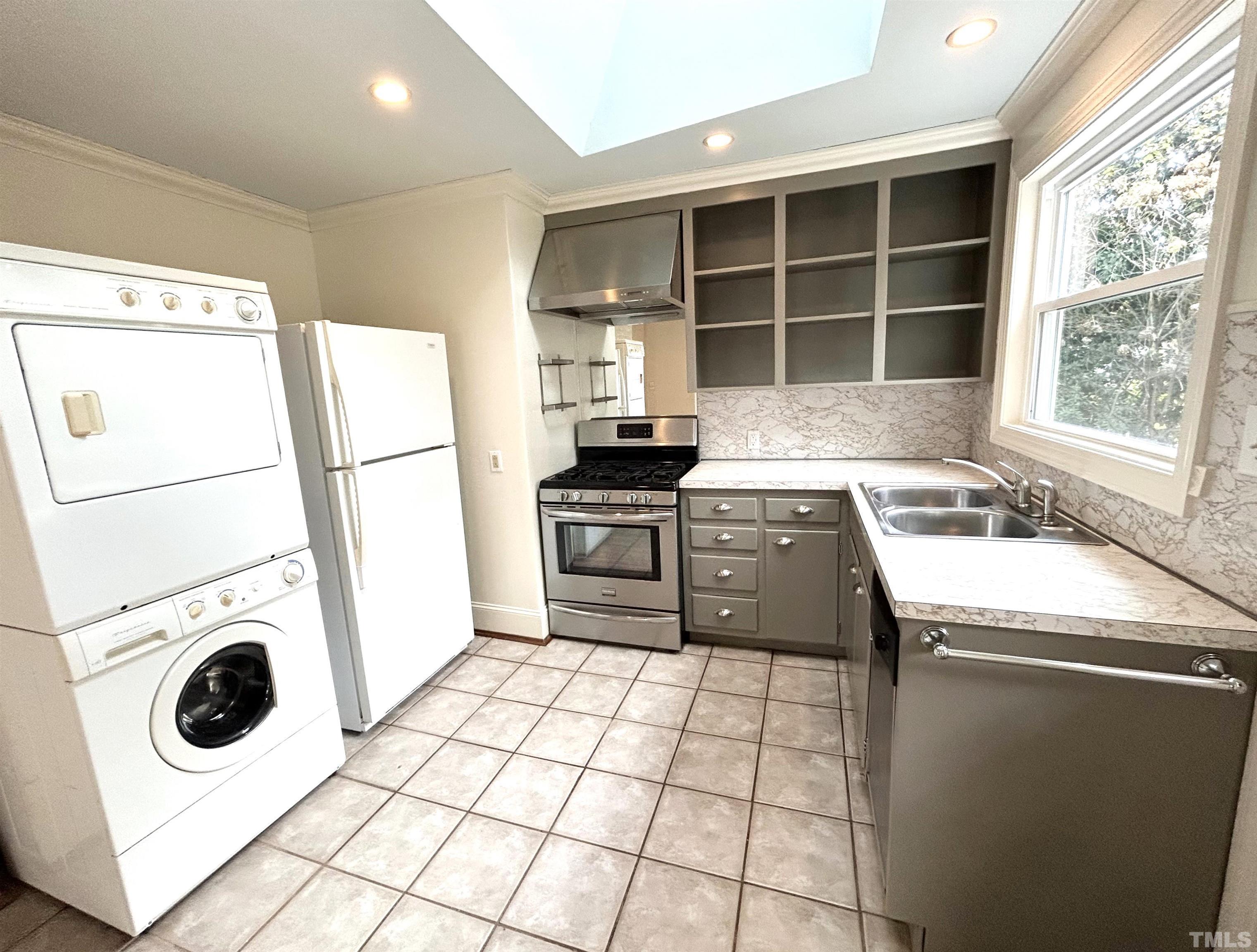 1607 Carson Street Raleigh, NC 27608 - Photo 7 of 17 a kitchen with a stove a sink and a refrigerator