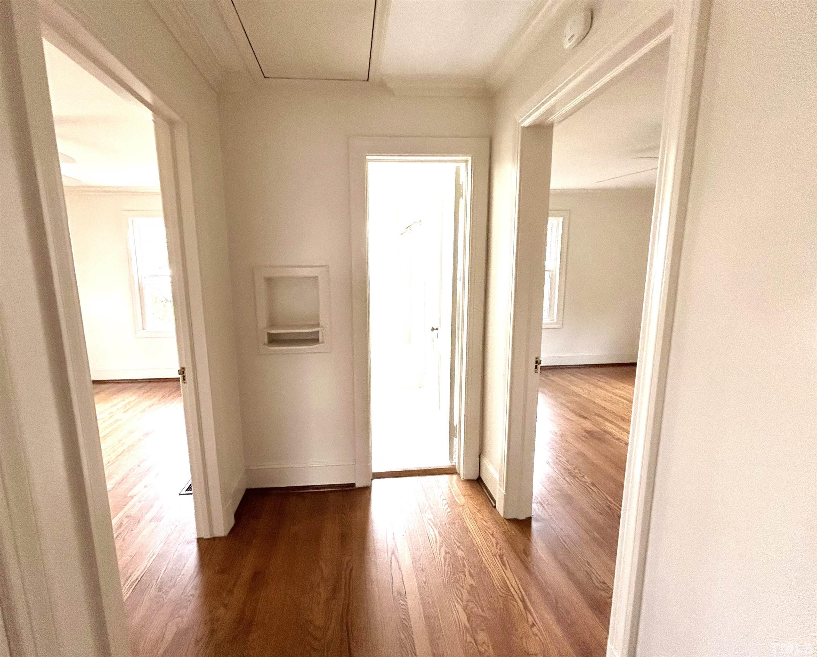 1607 Carson Street Raleigh, NC 27608 - Photo 10 of 17 a view of hallway with wooden floor