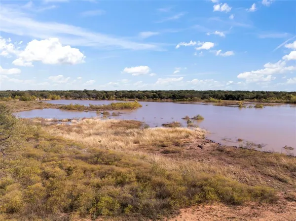 a view of lake with green space