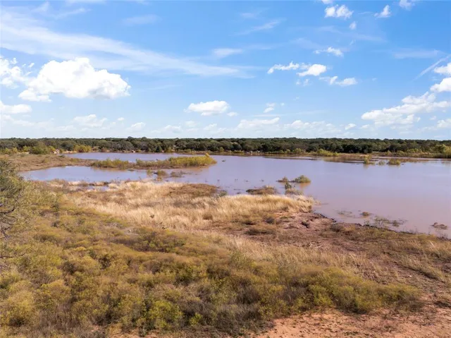 a view of lake with green space