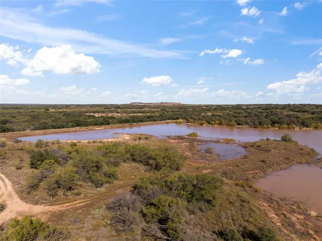 a view of a lake with houses in the background