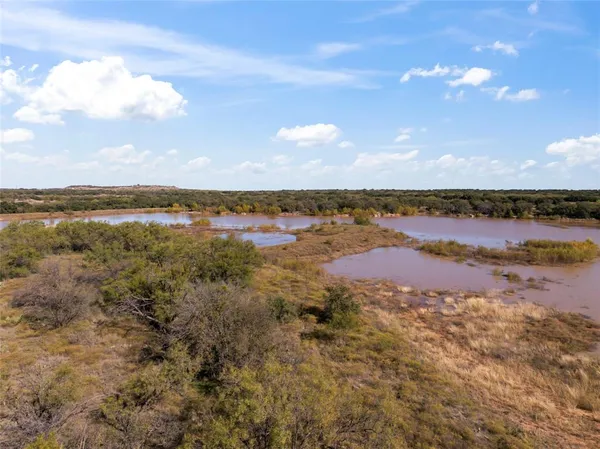 a view of an ocean and sunset