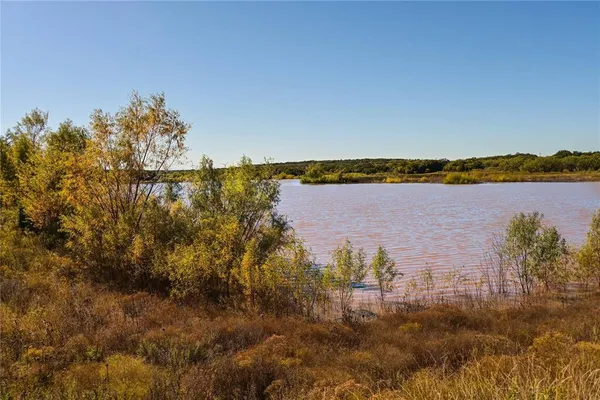a view of a lake with a city