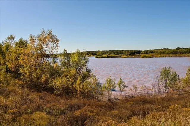 a view of a lake with a city