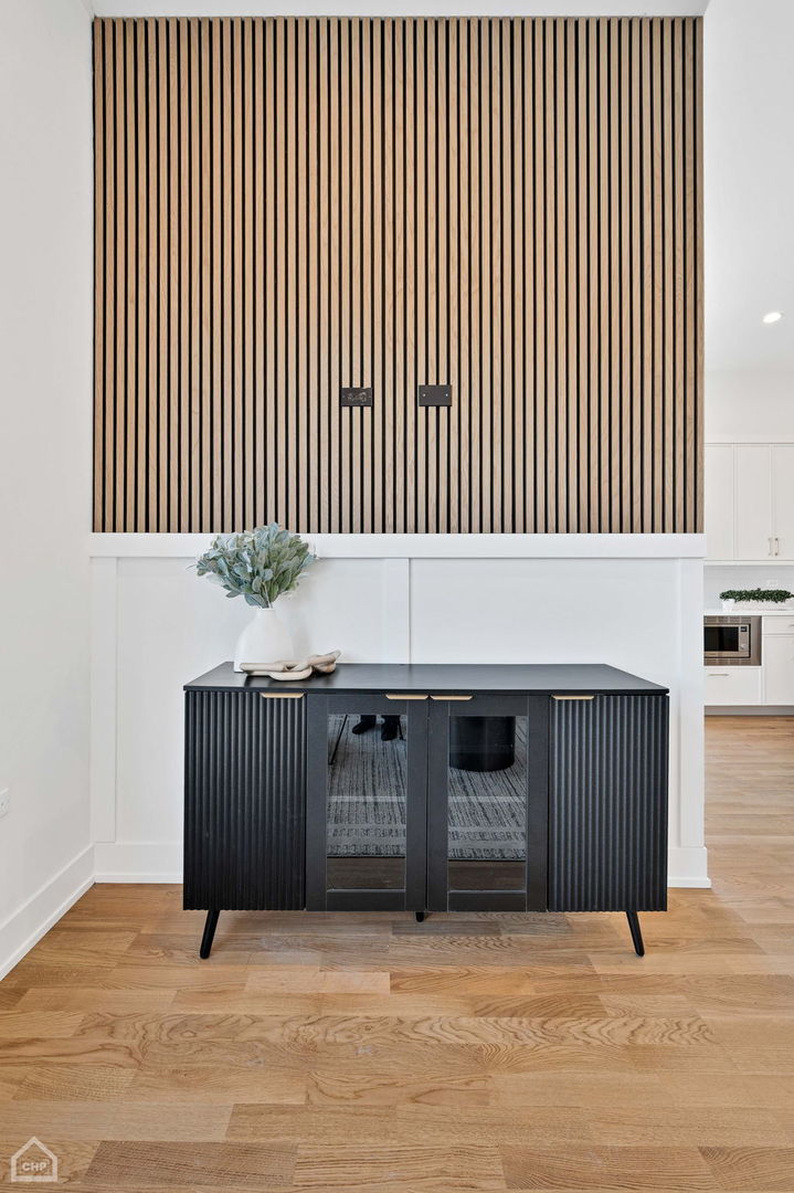 2127 West Madison Street, Unit 409 Chicago, IL 60612 - Photo 8 of 15 a view of a livingroom with an empty kitchen