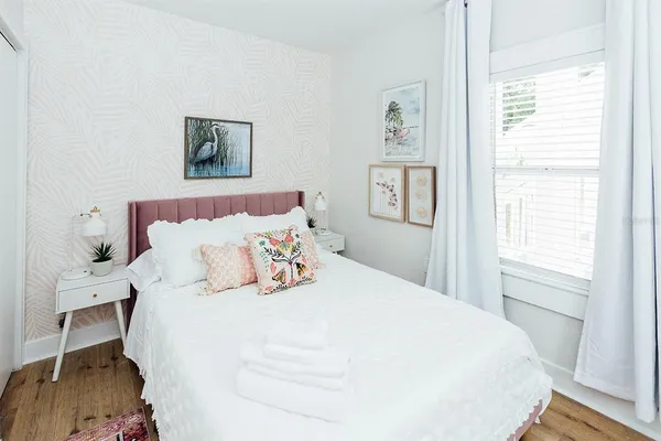 a white couch sitting next to a white wall