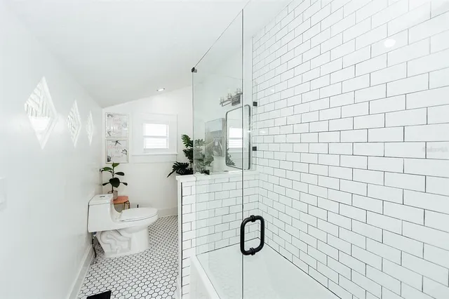 a bathroom with a sink mirror and vanity