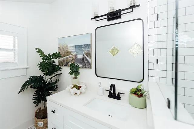 a bedroom with bed and a window