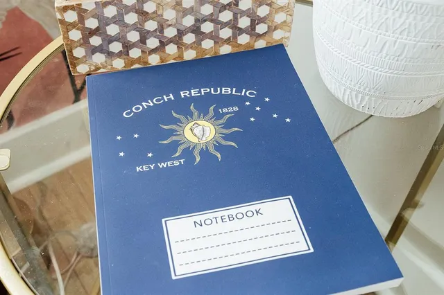 a view of a house with backyard porch and sitting area