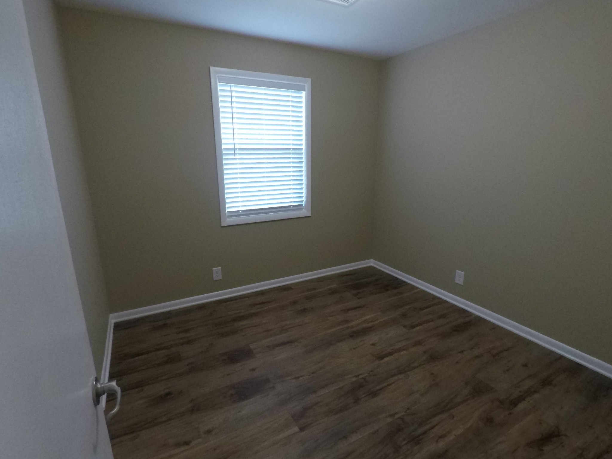 394 Limestone Road Elora, TN 37328 - Photo 18 of 31 an empty room with wooden floor and windows