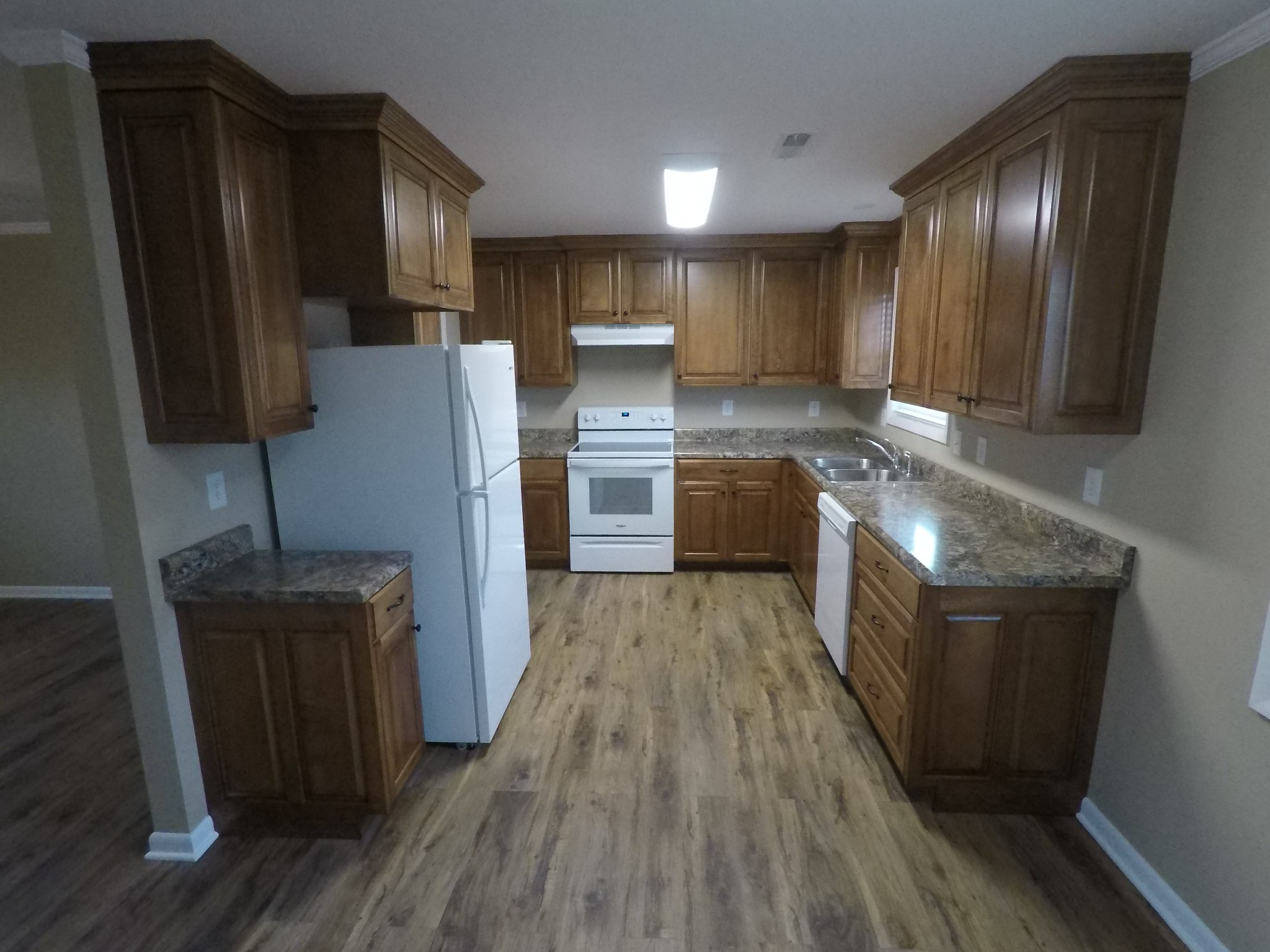 394 Limestone Road Elora, TN 37328 - Photo 24 of 31 a kitchen with stainless steel appliances granite countertop a refrigerator a stove top oven a sink and dishwasher