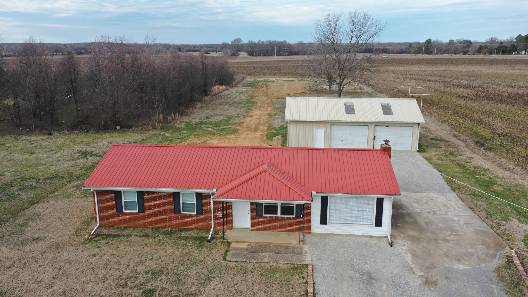 394 Limestone Road Elora, TN 37328 - Photo 3 of 31 a aerial view of a house next to a lake with couches chairs