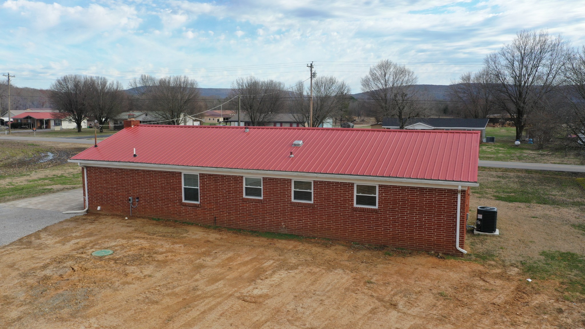 394 Limestone Road Elora, TN 37328 - Photo 8 of 31 a view of a big yard with a small car parked on the road