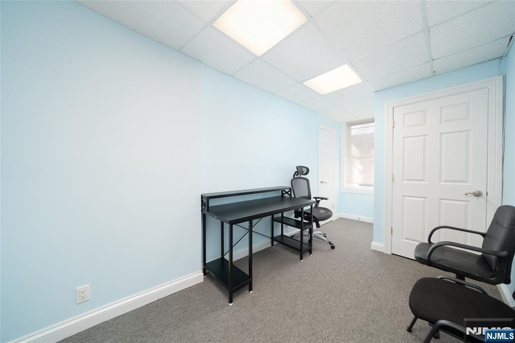 26 Orange Road Montclair, NJ 07042 - Photo 12 of 45 a view of a workspace with furniture and a window