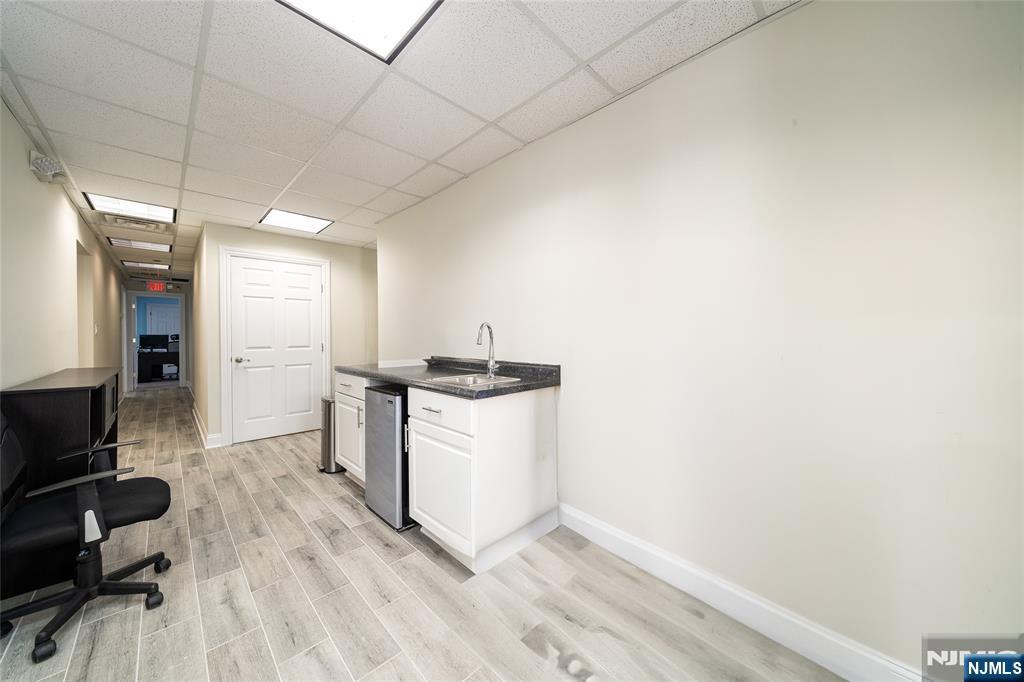 26 Orange Road Montclair, NJ 07042 - Photo 2 of 45 a room with a chair and white appliances