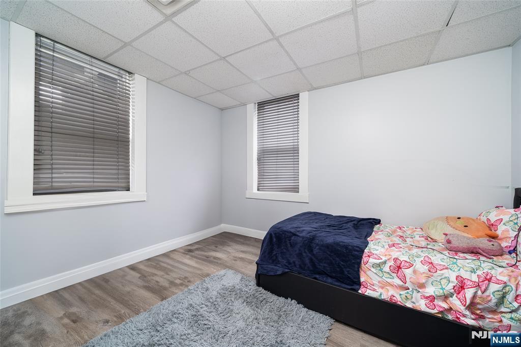 26 Orange Road Montclair, NJ 07042 - Photo 23 of 45 a bedroom with a bed and a window