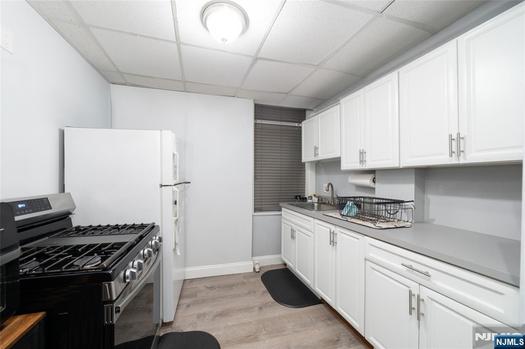 26 Orange Road Montclair, NJ 07042 - Photo 26 of 45 a kitchen with stainless steel appliances granite countertop a stove and a refrigerator