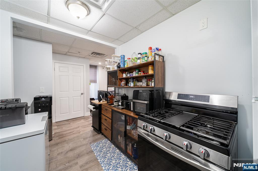 26 Orange Road Montclair, NJ 07042 - Photo 27 of 45 a kitchen with stainless steel appliances granite countertop a stove and a refrigerator