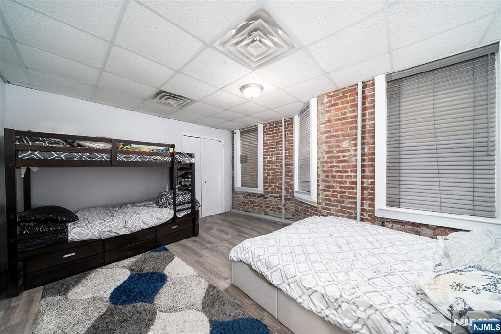 26 Orange Road Montclair, NJ 07042 - Photo 28 of 45 a bedroom with a bed and a window