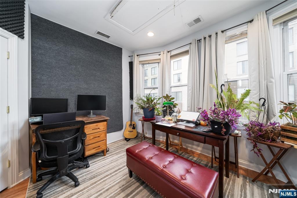 26 Orange Road Montclair, NJ 07042 - Photo 33 of 45 a living room with furniture and a potted plant