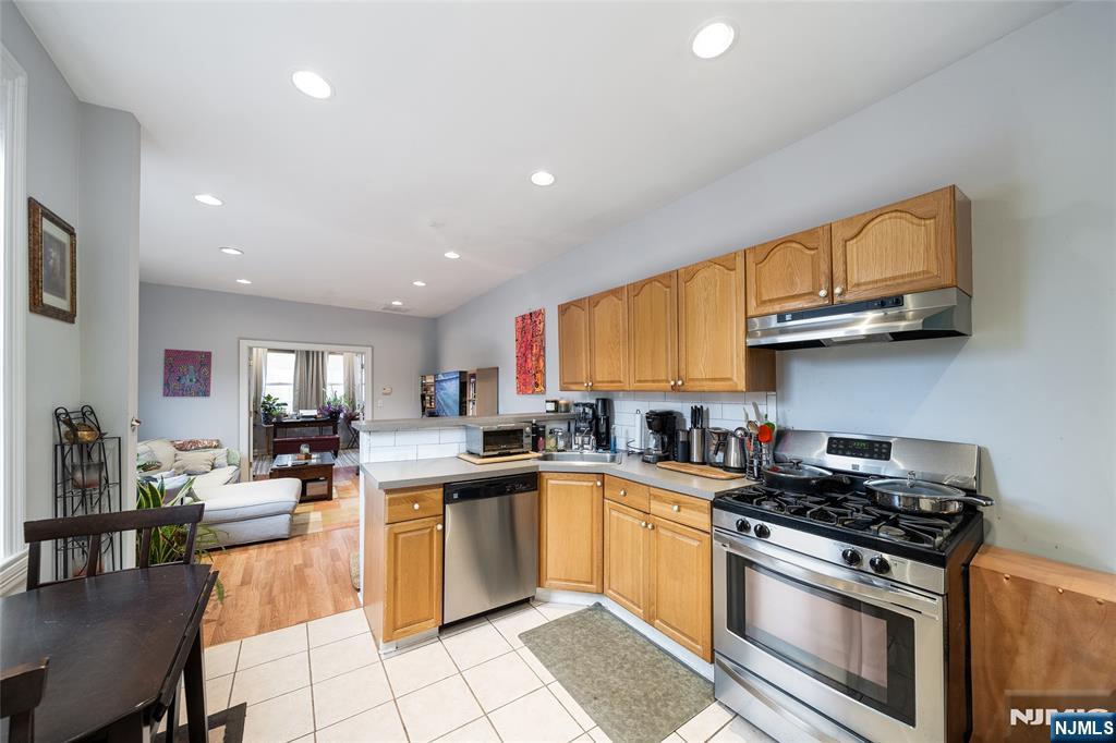 26 Orange Road Montclair, NJ 07042 - Photo 36 of 45 a kitchen with a sink a stove top oven and cabinetry