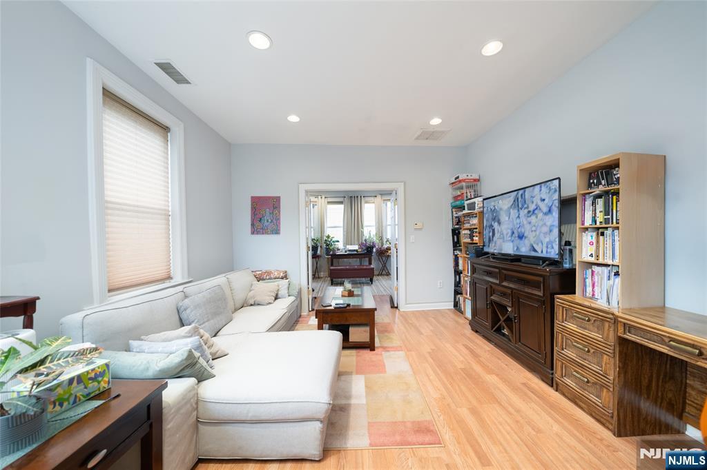 26 Orange Road Montclair, NJ 07042 - Photo 37 of 45 a living room with furniture and a flat screen tv