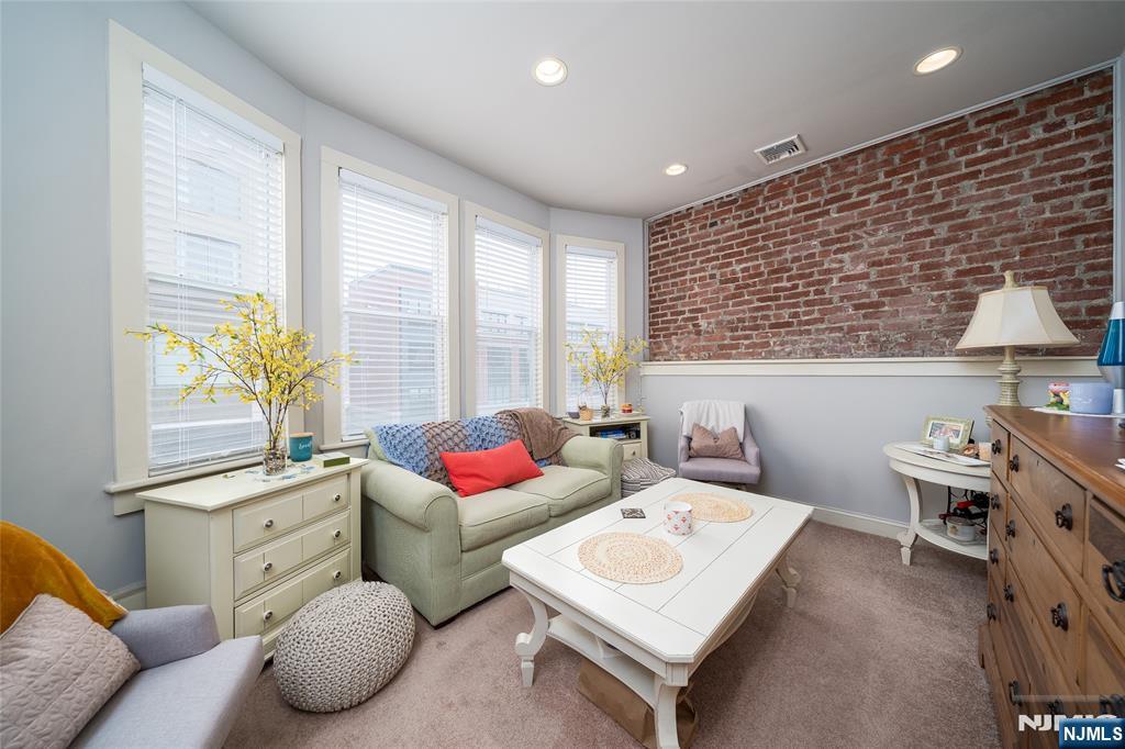 26 Orange Road Montclair, NJ 07042 - Photo 41 of 45 a living room with furniture and a large window