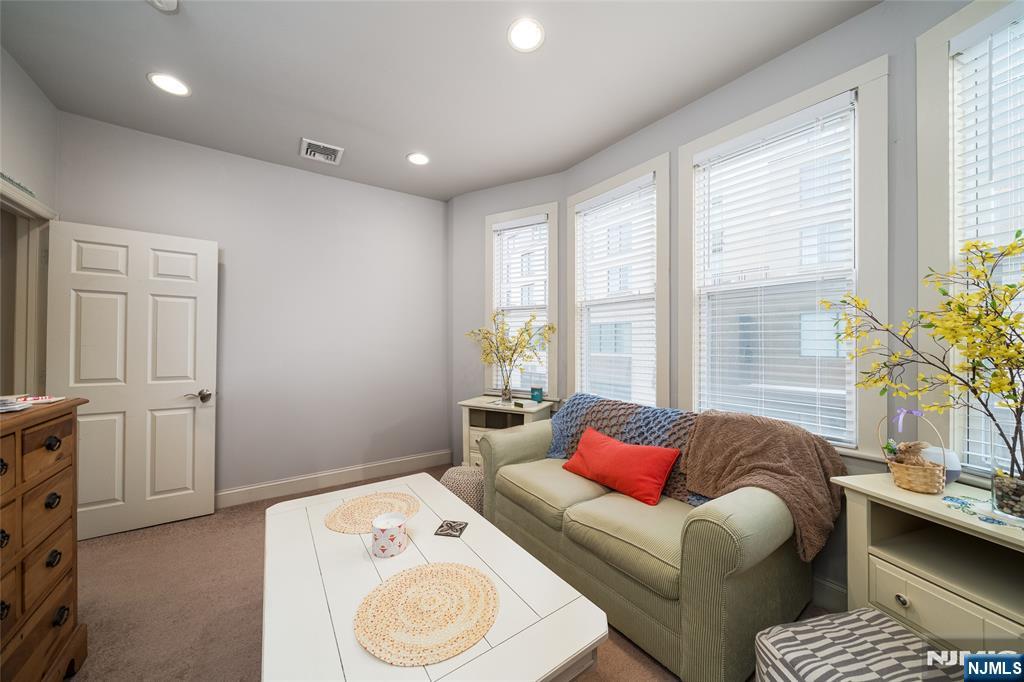 26 Orange Road Montclair, NJ 07042 - Photo 42 of 45 a bedroom with a bed and wooden floor