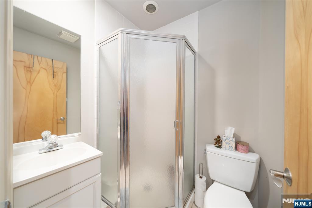 26 Orange Road Montclair, NJ 07042 - Photo 43 of 45 a bathroom with a sink a toilet and a mirror