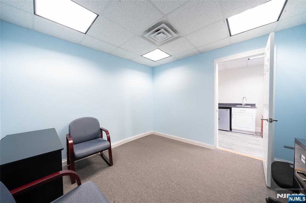 26 Orange Road Montclair, NJ 07042 - Photo 7 of 45 a hallway with chairs and a workspace