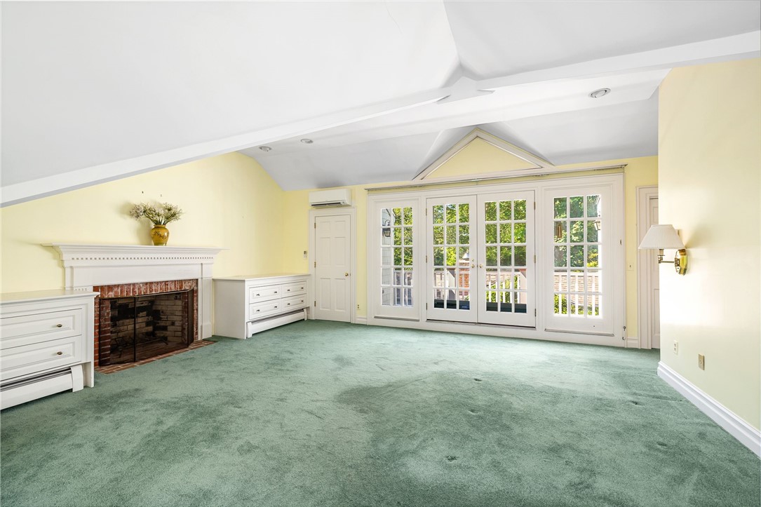 97 Harrison Avenue, Unit P1 Newport, RI 02840 - Photo 33 of 43 Primary bedroom with Fireplace and French doors to Deck