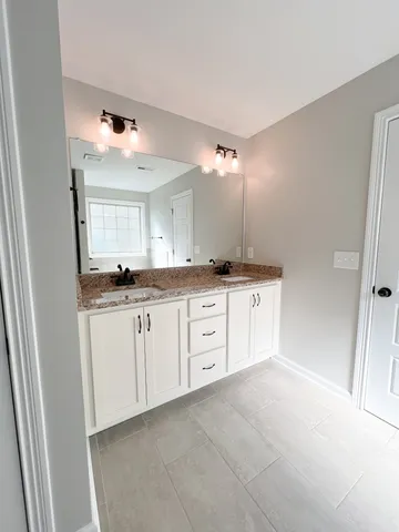 a spacious bathroom with a bathtub and a shower