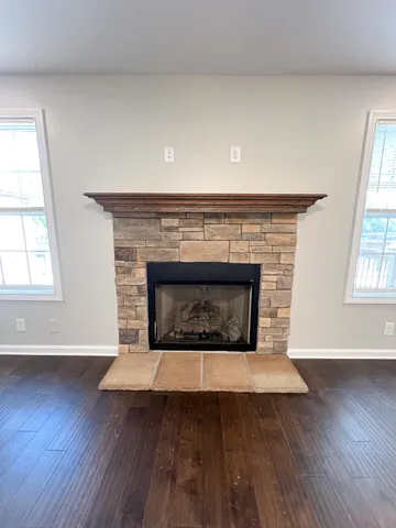 a open kitchen with furniture and a fireplace