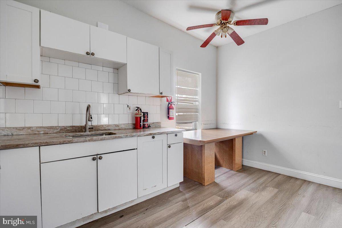 301 Broad Street Beverly, NJ 08010 - Photo 19 of 29 a kitchen with a sink cabinets and window
