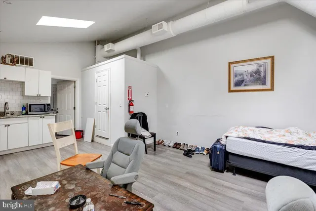 a bed room with furniture and a window