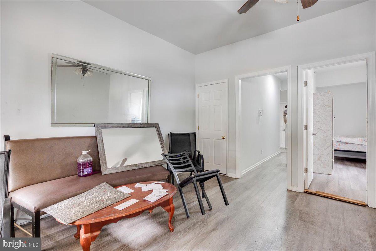 301 Broad Street Beverly, NJ 08010 - Photo 6 of 29 a living room with furniture and wooden floor