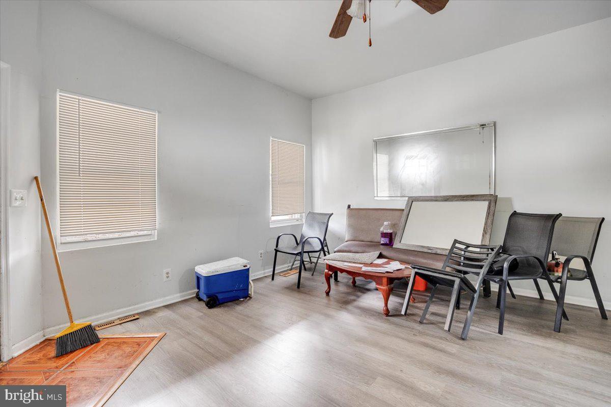 301 Broad Street Beverly, NJ 08010 - Photo 7 of 29 a living room with furniture and a wooden floor