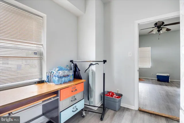 a hallway with a view of living room
