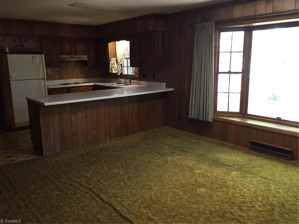 1614 Jackson Lake Road High Point, NC 27263 - Photo 3 of 15 Den and kitchen with bar area.