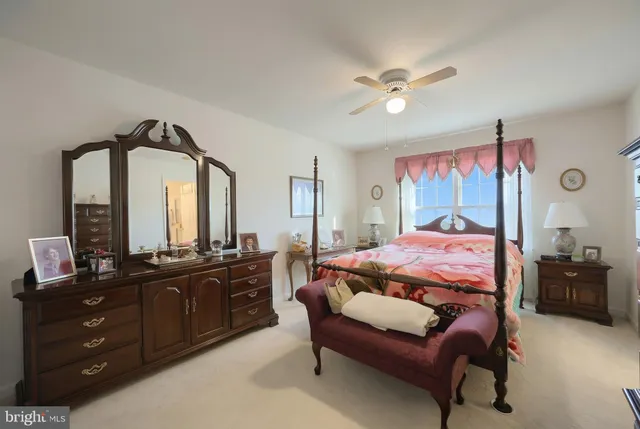 a bathroom with a double vanity sink a mirror and a shower