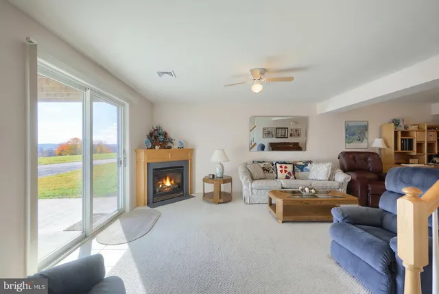 a view of a livingroom with workspace and a couch